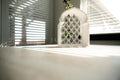 Sakoon Al-Qaws ("Tranquility Arch") Floating Mihrab Shelf with Lattice Back detail view – Taqwa Arts
